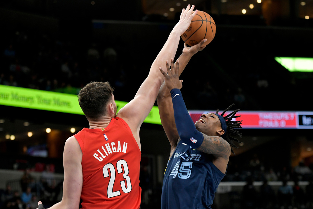 Portland Trail Blazers center Donovan Clingan (23) blocks a shot by Memphis Grizzlies forward GG Jackson II (45) in the first half of an NBA basketball game, Wednesday, March 4, 2026, in Memphis, Tenn. (AP Photo/Brandon Dill)