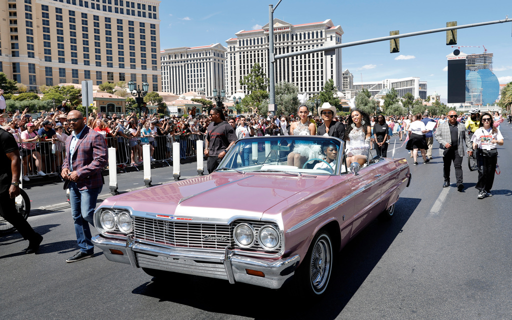Bruno Mars, center, rides in a parade on the Las Vegas Strip Friday, April 10, 2026, in Las Vegas, on "Bruno Mars Day." (Steve Marcus/Las Vegas Sun via AP)