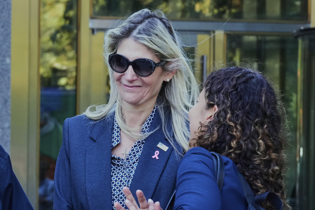 Nadine Menendez, left, wife of former U.S. Sen. Bob Menendez, accompanied by her lawyer Sarah Krissoff, leaves a Manhattan federal court in New York, Thursday, Sept. 11, 2025. (AP Photo/Richard Drew)