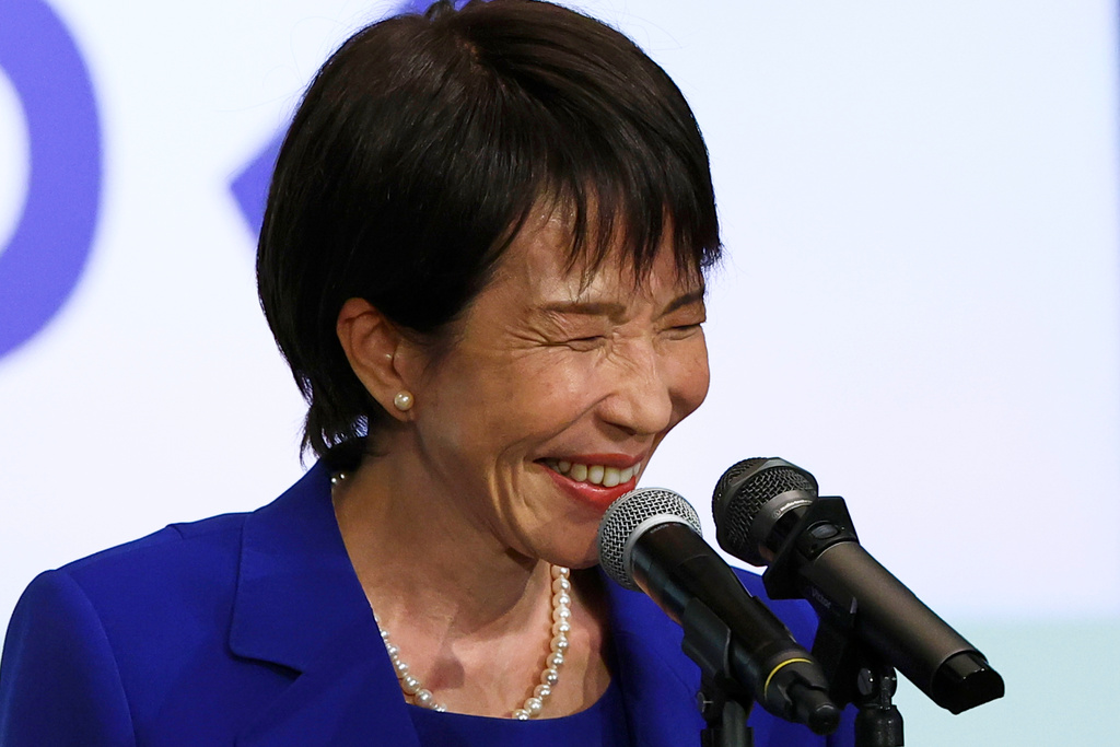 Newly-elected leader of Japan's Liberal Democratic Party (LDP) Sanae Takaichi smiles while delivering a speech after winning the LDP leadership election in Tokyo, Japan, Saturday, Oct. 4, 2025. (Kim Kyung-Hoon/Pool Photo via AP)