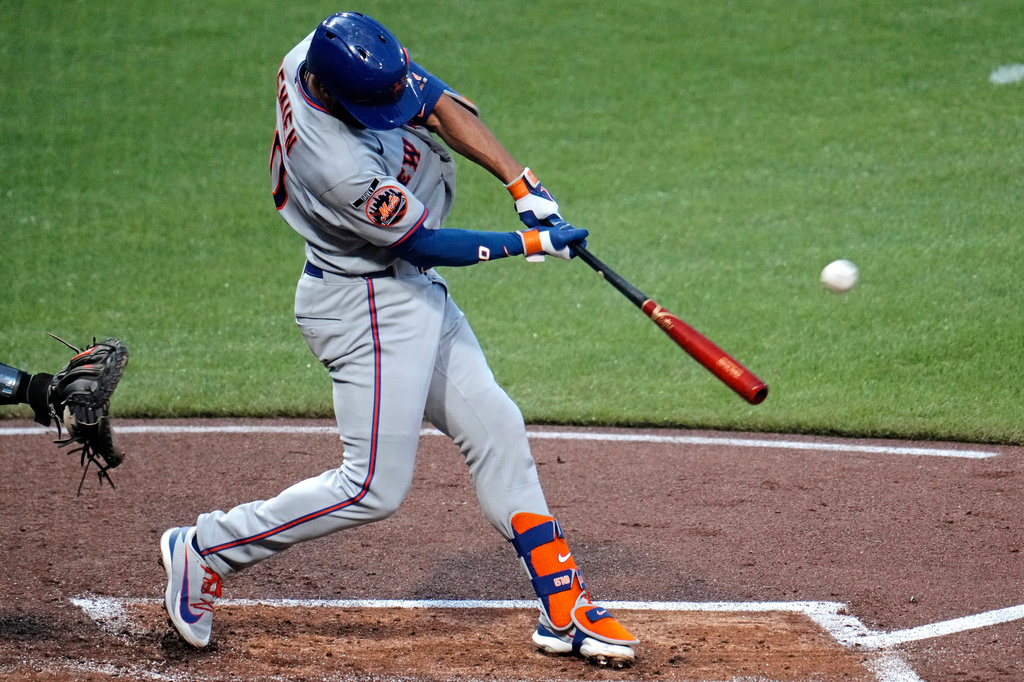 New York Mets' Marcus Semien hits a three-run home run off Pittsburgh Pirates pitcher Carmen Mlodzinski during the third inning of a baseball game in Pittsburgh, Friday, Aug. 7, 2026. (AP Photo/Gene J. Puskar)