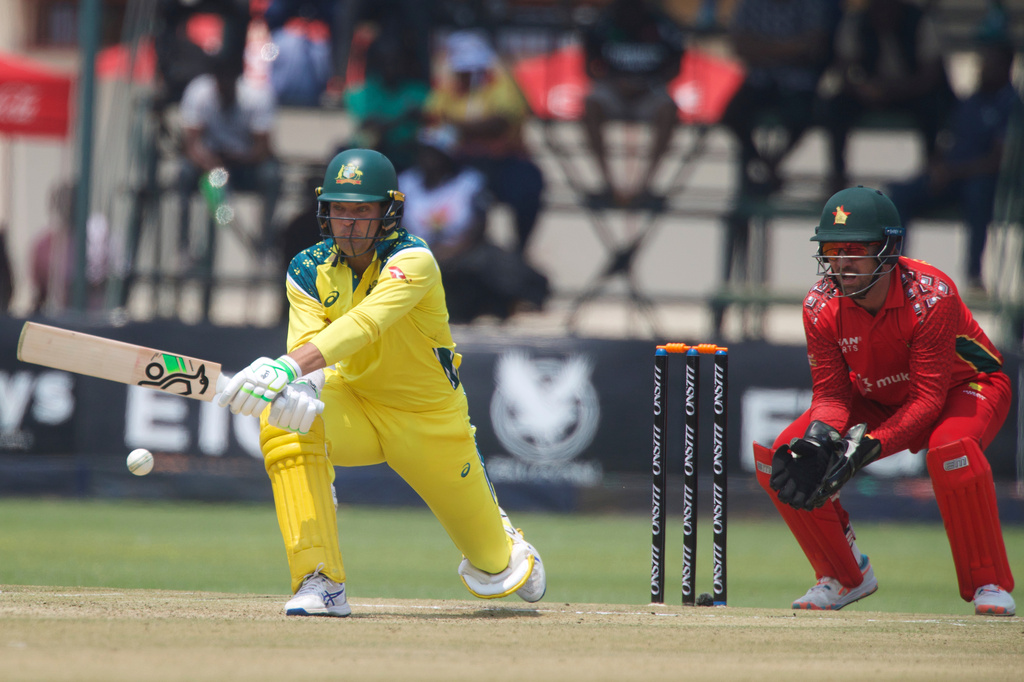 Australia's batsman Alex Carey, left, plays a shot whilst Zimbabwe's wicketkeeper Brendan Taylor watches on during the second one-day international cricket match between Zimbabwe and Australia in Harare, Zimbabwe, Friday, Sept.18, 2026. (AP Photo/Wonder Mashura)