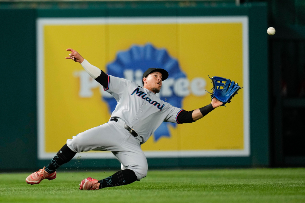 Miami Marlins left fielder Heriberto Hernández catches a ball hit by Washington Nationals' Luis García Jr. during the sixth inning of a baseball game, Monday, June 1, 2026, in Washington. (AP Photo/Jess Rapfogel)