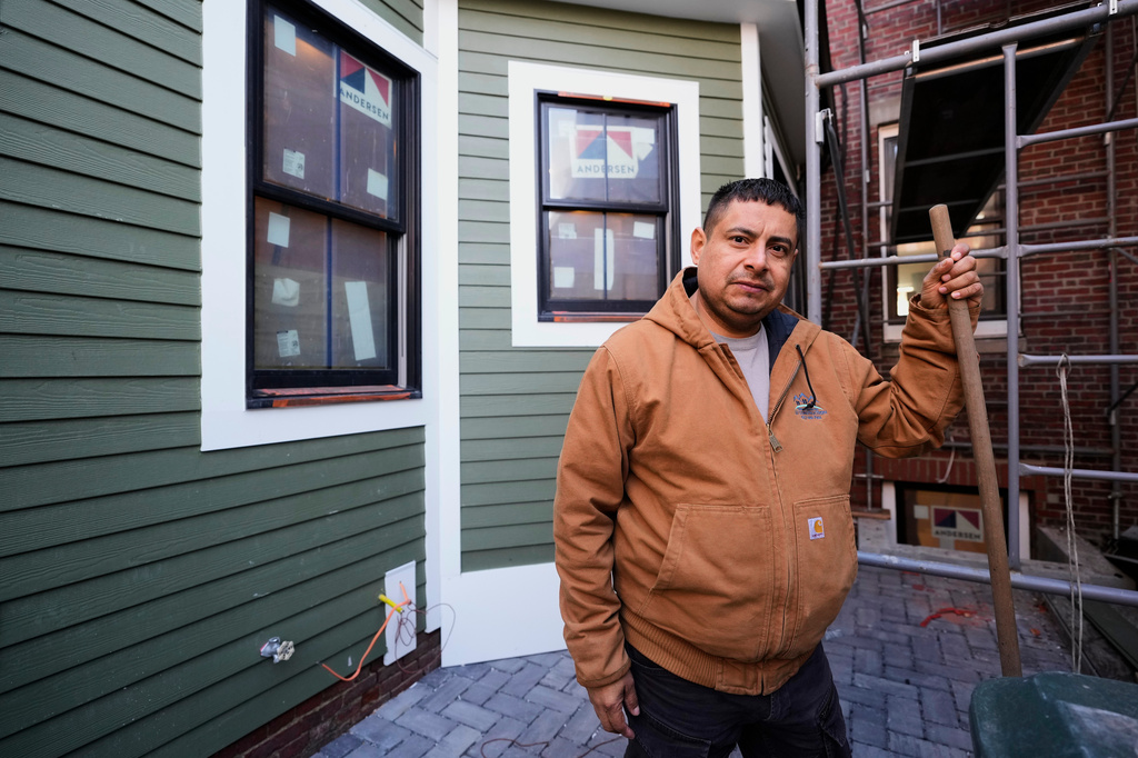 General contractor Jose Urias, a Salvadoran who has had Temporary Protected Status in the U.S. since 2001, pauses while working at a high-end apartment his crew is remodeling, Wednesday, March 25, 2026, in Charleston, Mass. (AP Photo/Robert F. Bukaty)