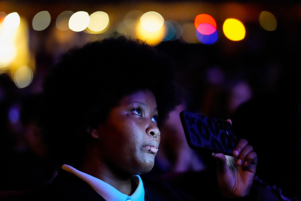 A woman listens to former Vice President Kamala Harris speak, Friday, Oct. 17, 2025, in Birmingham, Ala. (AP Photo/Mike Stewart)