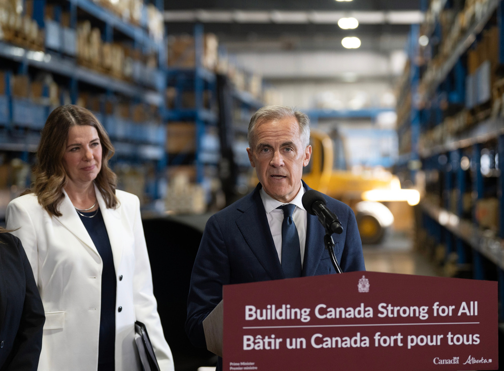 Canada's Prime Minister Mark Carney and Alberta Premier Danielle Smith announce a proposed pipeline from Alberta to the B.C. coast in Calgary, Thursday, July 02, 2026. (Todd Korol/The Canadian Press via AP)