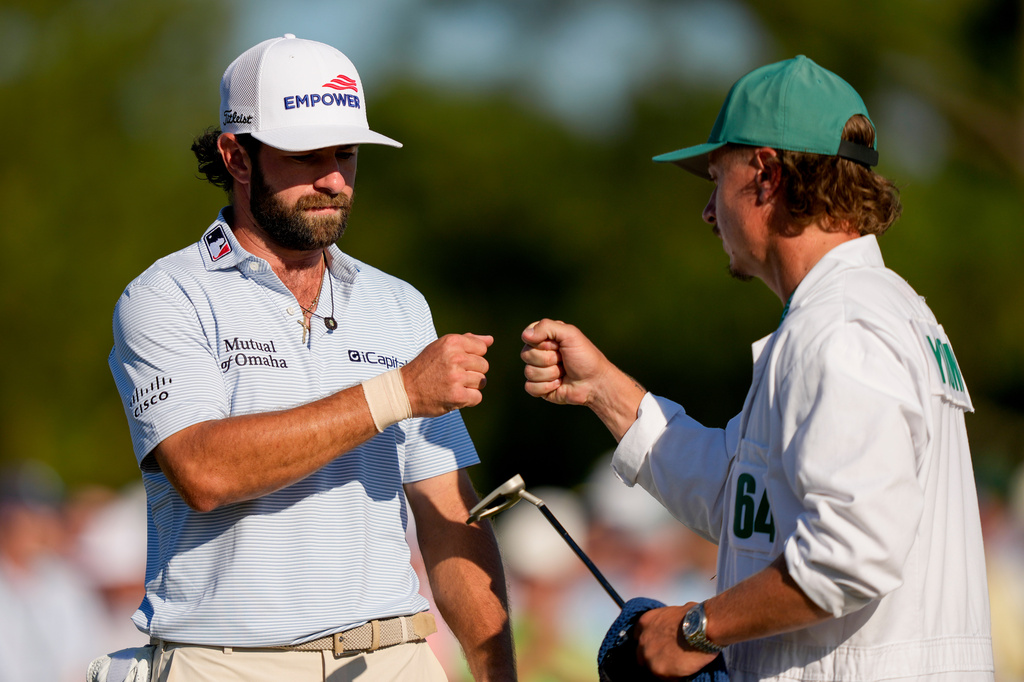 Cameron Young celebrates after a putt on the 18th hole during the third round of the Masters golf tournament at the Augusta National Golf Club, Saturday, April 11, 2026, in Augusta, Ga. (AP Photo/Matt Slocum)