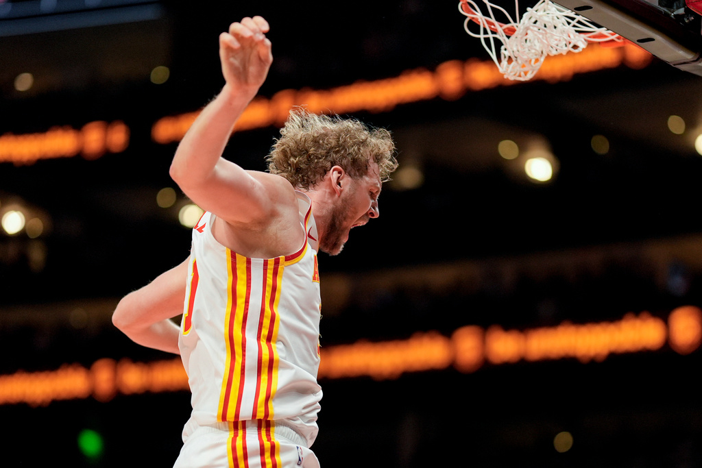 Atlanta Hawks center Jock Landale (31) celebrates his dunk against the Portland Trail Blazers during the first half of an NBA basketball game, Sunday, March 1, 2026, in Atlanta. (AP Photo/Mike Stewart)