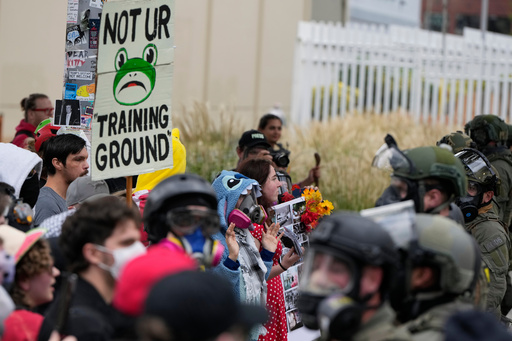 Demonstrators standoff against Immigration and Customs Enforcement agents outside an ICE facility on Saturday, Oct. 4, 2025, in Portland, Ore. (AP Photo/Jenny Kane) Demonstrators standoff against Immigration and Customs Enforcement agents outside an ICE facility on Saturday, Oct. 4, 2025, in Portland, Ore. (AP Photo/Jenny Kane)