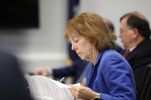 South Carolina Election Commission member Joanne Day looks through paperwork at the commission's meeting on Wednesday, Oct. 15, 2025, in Columbia, S.C. (AP Photo/Jeffrey Collins) South Carolina Election Commission member Joanne Day looks through paperwork at the commission's meeting on Wednesday, Oct. 15, 2025, in Columbia, S.C. (AP Photo/Jeffrey Collins)