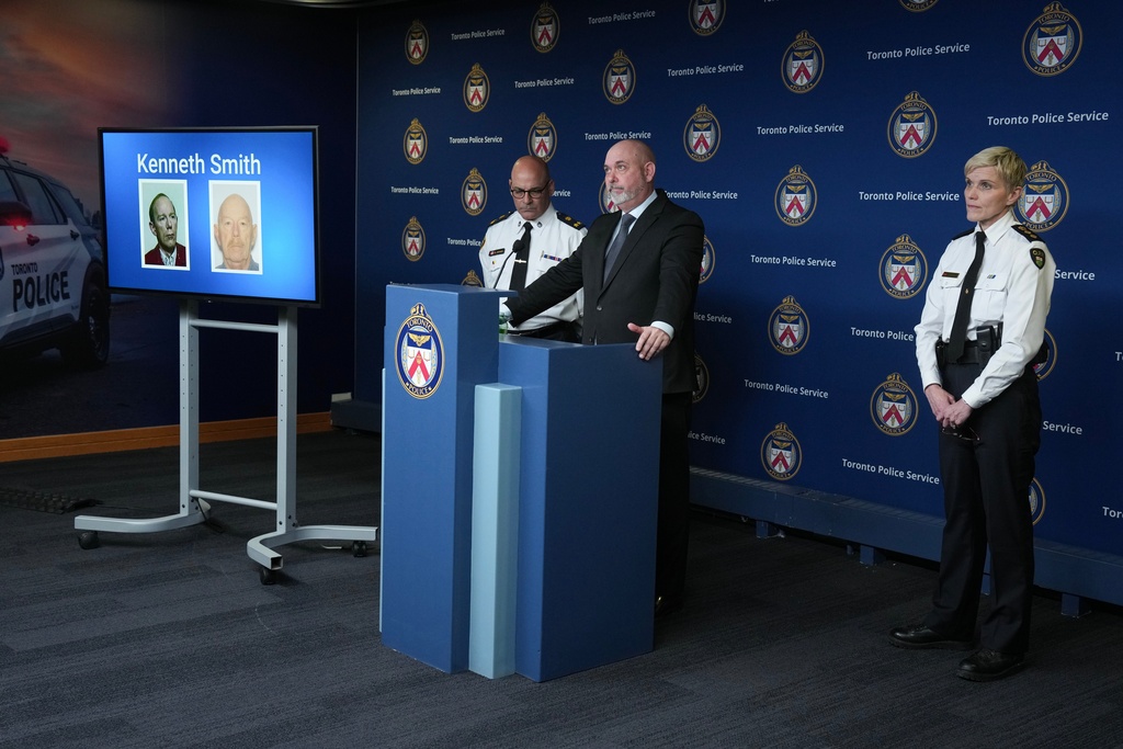 Detective Sergeant Steve Smith of the Cold Case Unit, center, Deputy Chief Rob Johnson, left, and Chief Superintendent Karen Gonneau of the Ontario Provincial Police provide a development in three historical homicide investigations, Thursday, Dec. 11, 2025, during a news conference at police headquarters in Toronto. (Chris Young/The Canadian Press via AP)