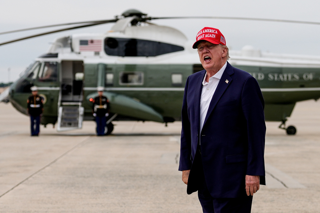 President Donald Trump yells to reporters after disembarking Air Force One, Sunday, Aug. 16, 2026, at Joint Base Andrews, Md. (AP Photo/Julia Demaree Nikhinson)