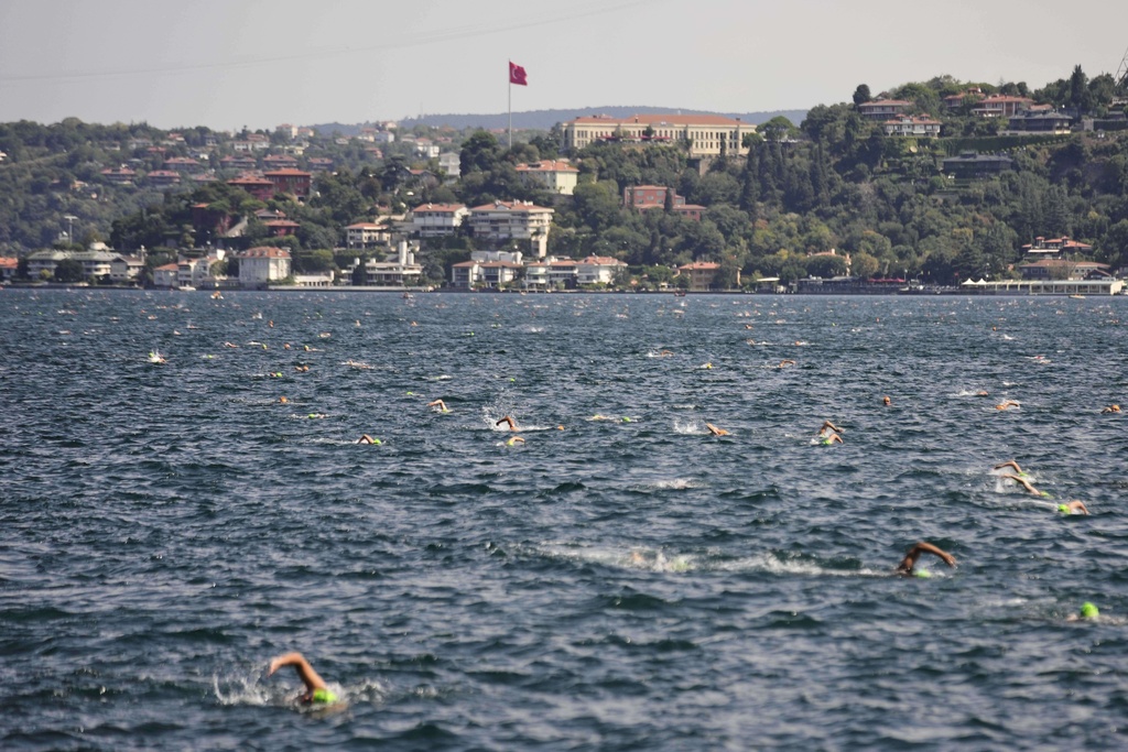 Participants compete in a 6.5km swimming race across the Bosporus Strait, from the Asian side to the European side, in Istanbul, Turkey, Sunday, Aug. 24, 2025. (AP Photo/Khalil Hamra)