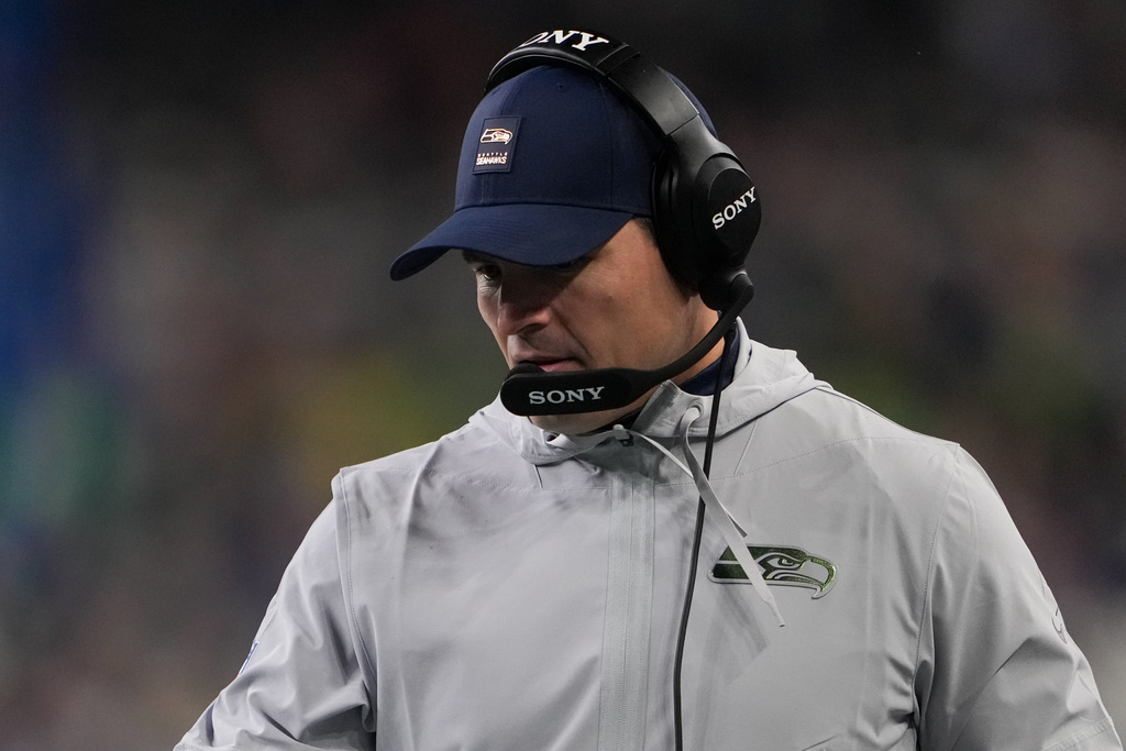 Seattle Seahawks head coach Mike MacDonald walks the sideline during the first half of an NFL football game against the Los Angeles Rams, Thursday, Dec. 18, 2025, in Seattle. (AP Photo/Lindsey Wasson)