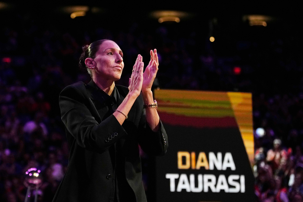 Retired WNBA Phoenix Mercury basketball player Diana Taurasi is honored during a halftime Ring of Honor ceremony Sunday, Aug. 16, 2026, in Phoenix. (AP Photo/Ross D. Franklin)