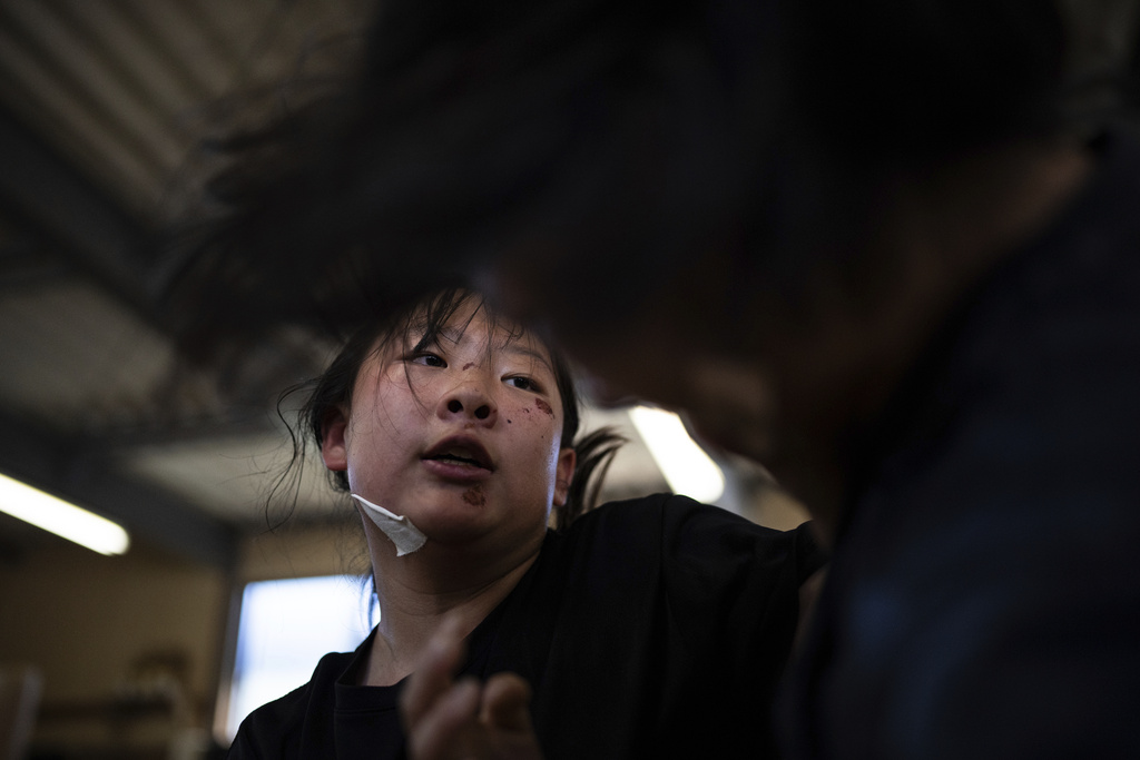 Wrestlers train during a practice session at a sumo camp in Tottori Johoku High School in Tottori, Japan, on July 28, 2025. (AP Photo/Louise Delmotte)