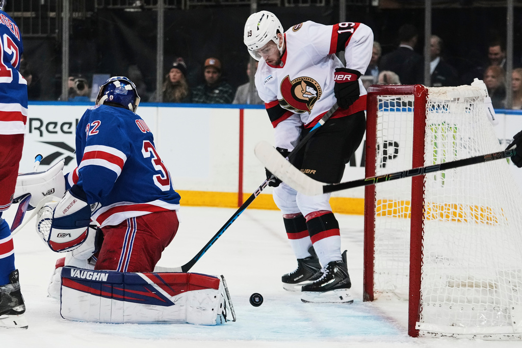 Ottawa Senators' Drake Batherson (19) scores a goal as New York Rangers goaltender Jonathan Quick (32) reacts during the first period of an NHL hockey game Wednesday, Jan. 14, 2026, in New York. (AP Photo/Frank Franklin II)