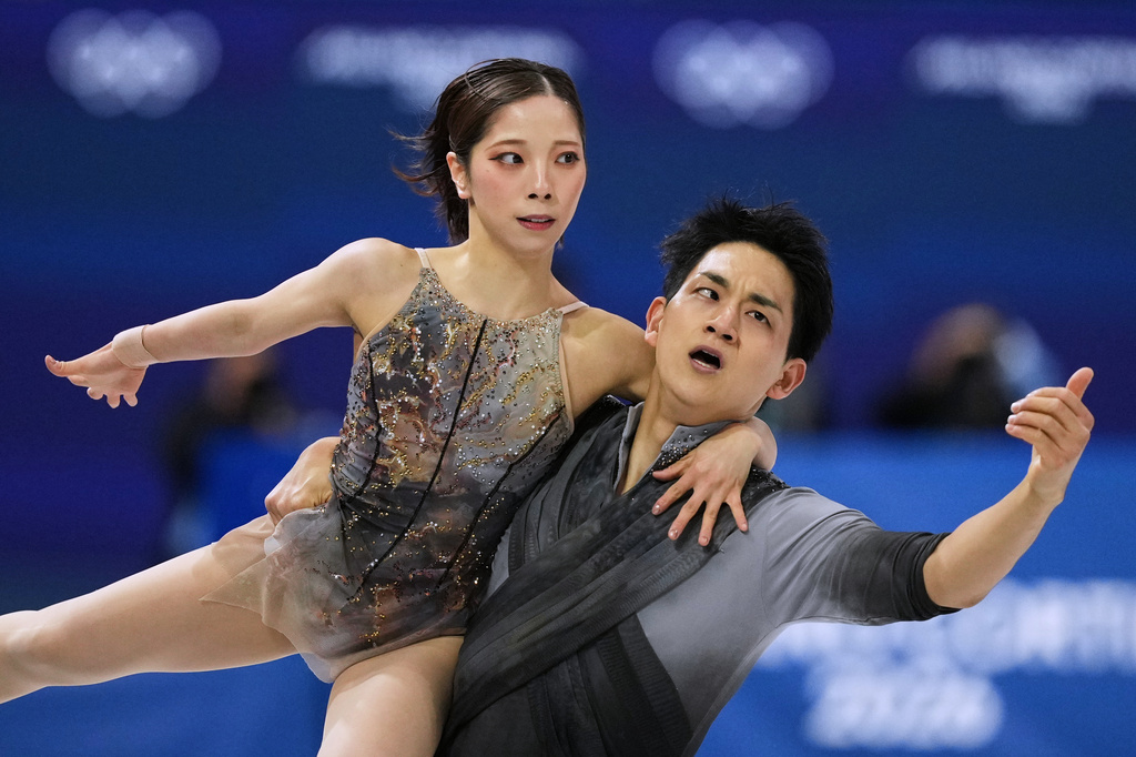 FILE -Riku Miura and Ryuichi Kihara of Japan compete during the pairs figure skating long program at the 2026 Winter Olympics, in Milan, Italy, Monday, Feb. 16, 2026. (AP Photo/Francisco Seco, File)