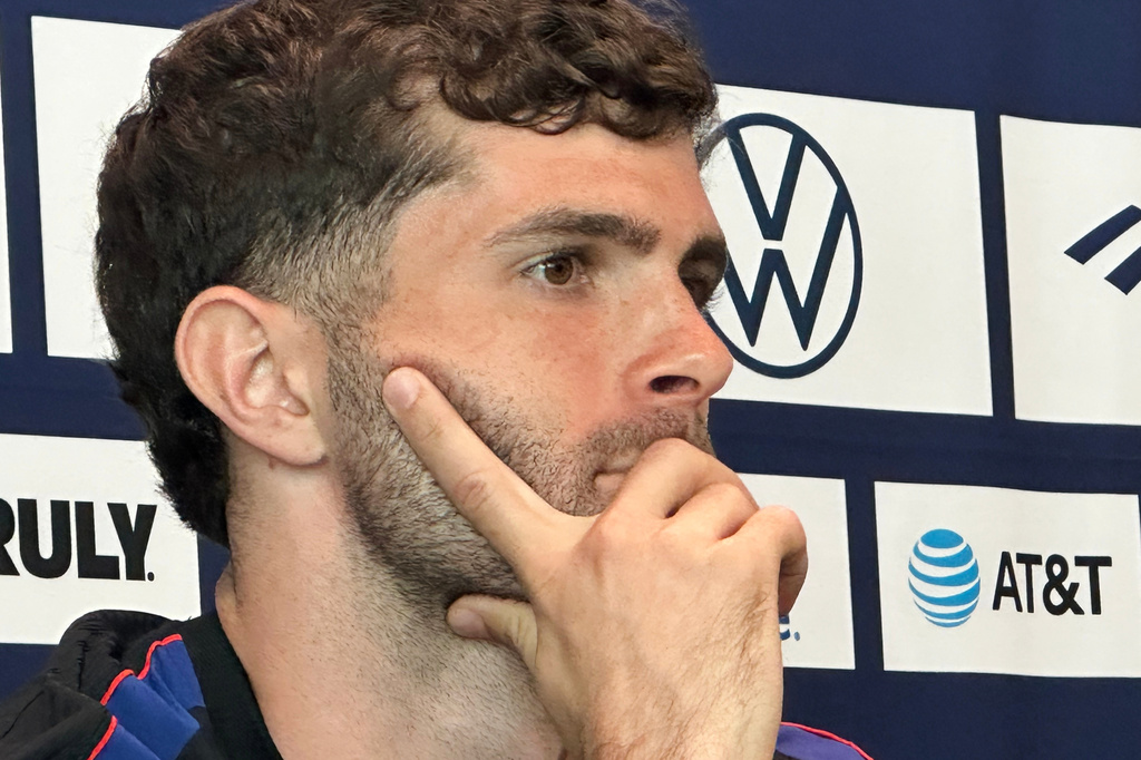 Unites States' Christian Pulisic listens during a news conference before the men's national soccer team training, Friday, March 27, 2026, in Marietta, Ga. (AP Photo/Ronald Blum