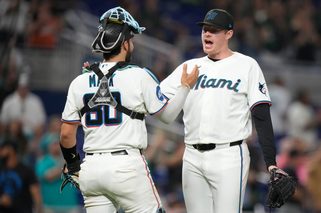 Miami Marlins relief pitcher Pete Fairbanks, right, reacts with starting pitcher Joe Mack (80) after the Marlins defeated the San Francisco Giants in a baseball game, June 20, 2026, in Miami. (AP Photo/Lynne Sladky)