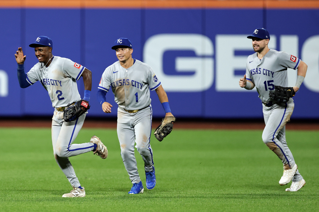 Kansas City Royals' Tyler Tolbert (2) celebrates with Isaac Collins (1) and Lane Thomas (15) after defeating the New York Mets in a baseball game Tuesday, July 7, 2026, in New York. (AP Photo/Adam Hunger)
