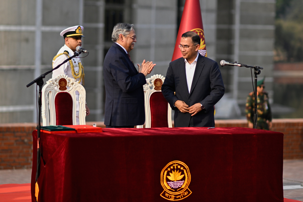 President of Bangladesh Mohammed Shahabuddin, left, congratulates Tarique Rahman, Chairperson of the Bangladesh Nationalist Party after administering him oath of Prime Minister of Bangladesh at the National Parliament in Dhaka, Bangladesh, Tuesday, Feb. 17, 2026. (AP Photo/Mahmud Hossain Opu)