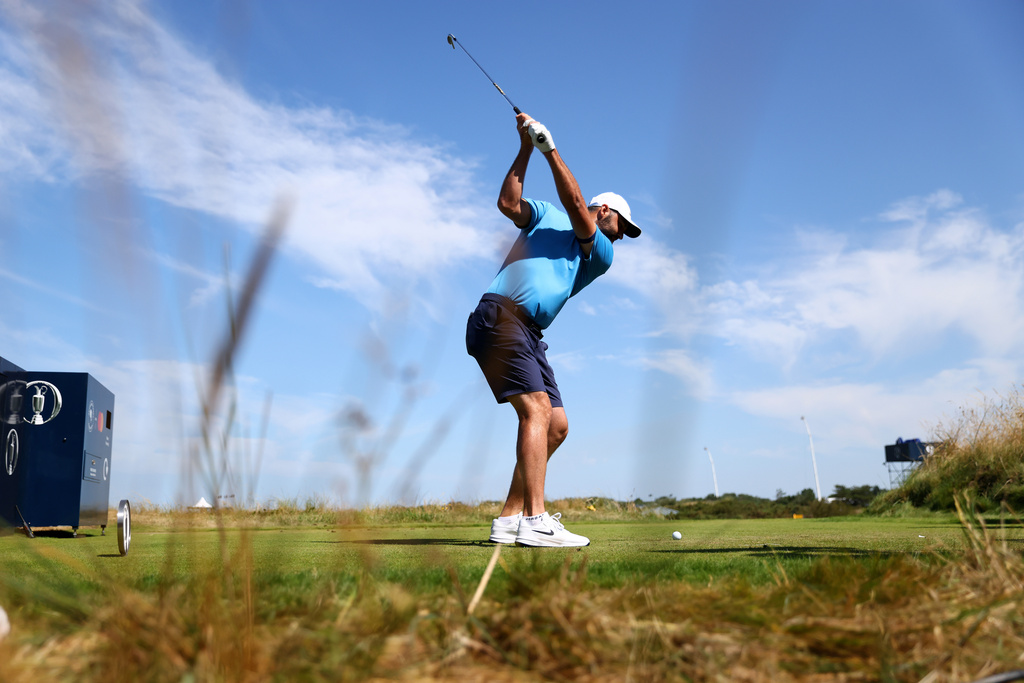 US golfer Scottie Scheffler tees off during a practice round at the British Open Golf Championship at Royal Birkdale, Southport, England, Monday, July 13, 2026. (AP Photo/Peter Morrison)