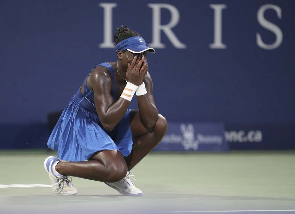 Victoria Mboko, of Canada, celebrates after her win over Naomi Osaka, of Japan, in final action at the National Bank Open women's tennis tournament in Montreal, Thursday, Aug. 7, 2025. (Christinne Muschi/The Canadian Press via AP)