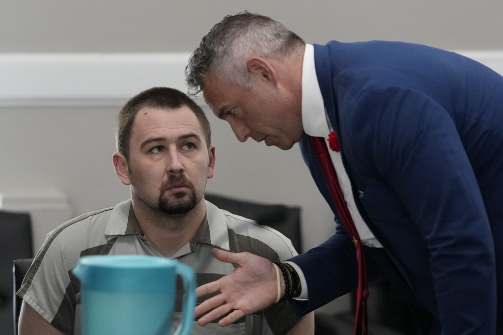Defendant Austin Drummond, left, accused of quadruple murder, speaks to his attorney Jere Mason, right, as he appears in court during a preliminary hearing, Thursday, Sept. 4, 2025, in Tiptonville, Tenn. (AP Photo/George Walker IV, Pool)