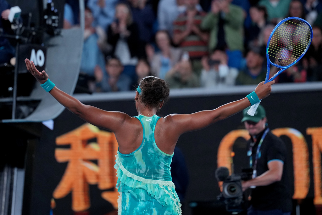 Naomi Osaka of Japan reacts after defeating Sorana Cirstea of Romania in their second round match at the Australian Open tennis championship in Melbourne, Australia, Thursday, Jan. 22, 2026. (AP Photo/Dita Alangkara)