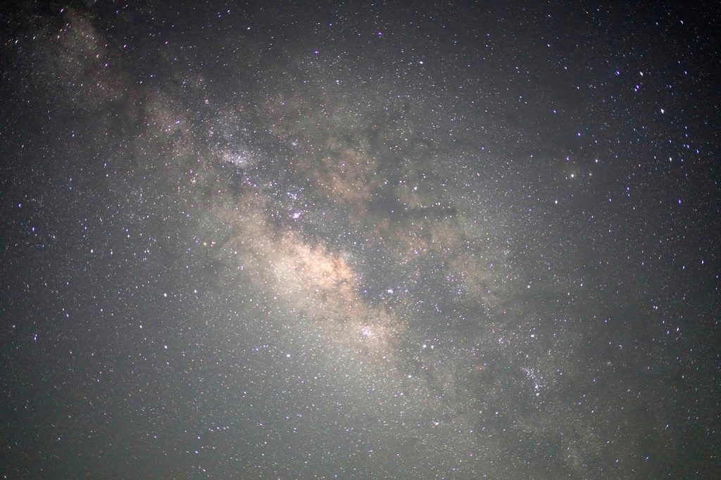 The Milky Way galaxy is seen in this long-exposure photograph from the Al Quaa Desert outside of Abu Dhabi, United Arab Emirates, Sunday, May 24, 2026. (AP Photo/Jon Gambrell)