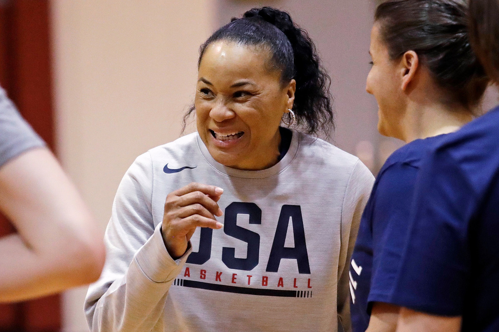 FILE - Coach Dawn Staley talks with players and assistant coaches during a practice for the U.S. women's basketball team in Seattle on April 24, 2018. (AP Photo/Elaine Thompson, File)