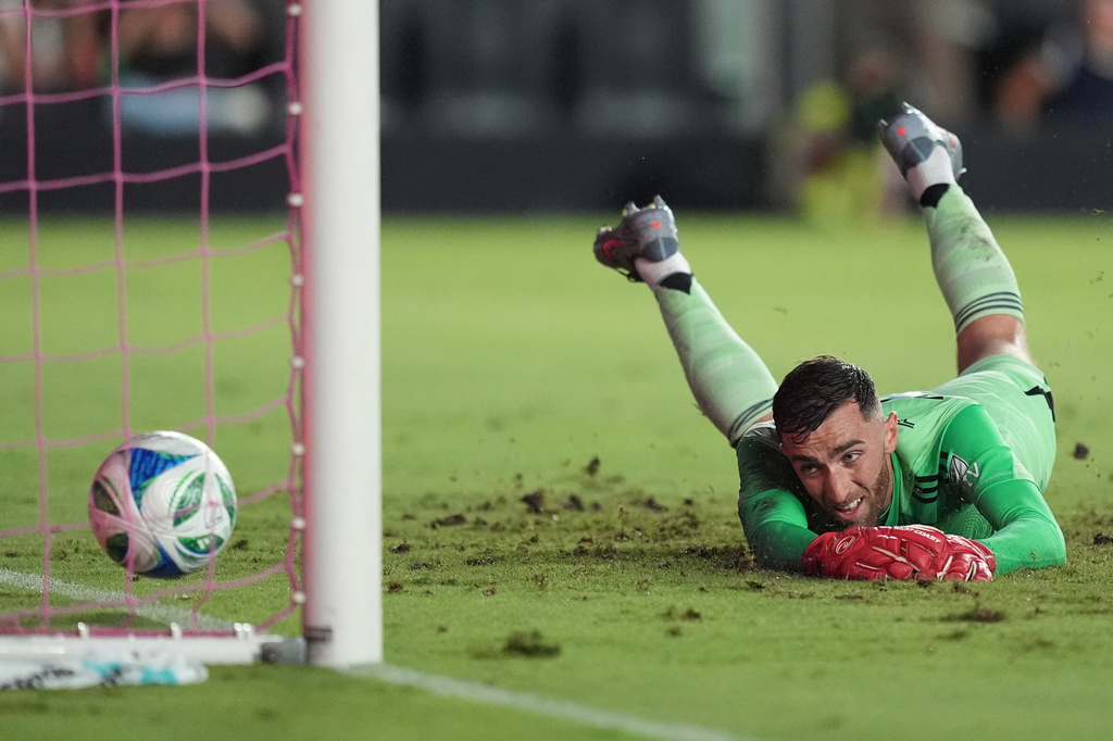 New England Revolution goalkeeper Matt Turner (30) watches as a ball kicked by Inter Miami defender Jordi Alba gets past him into the net for side's second goal, during the first half of an MLS soccer match, Saturday, Oct. 4, 2025, in Fort Lauderdale, Fla. (AP Photo/Rebecca Blackwell)