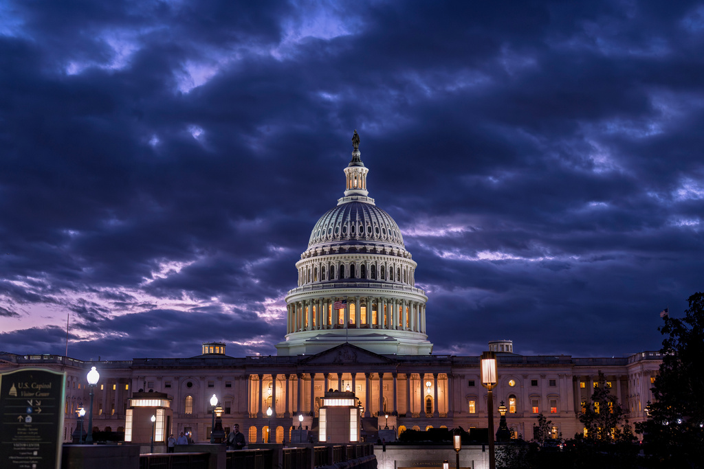 FILE - The Capitol is seen at nightfall on day 22 of a government shutdown in Washington, Oct. 22, 2025. (AP Photo/J. Scott Applewhite, File)