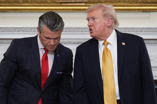 President Donald Trump talks with Defense Secretary Pete Hegseth after a roundtable on criminal cartels in the State Dining Room of the White House, Thursday, Oct. 23, 2025, in Washington. (AP Photo/Evan Vucci) President Donald Trump talks with Defense Secretary Pete Hegseth after a roundtable on criminal cartels in the State Dining Room of the White House, Thursday, Oct. 23, 2025, in Washington. (AP Photo/Evan Vucci)