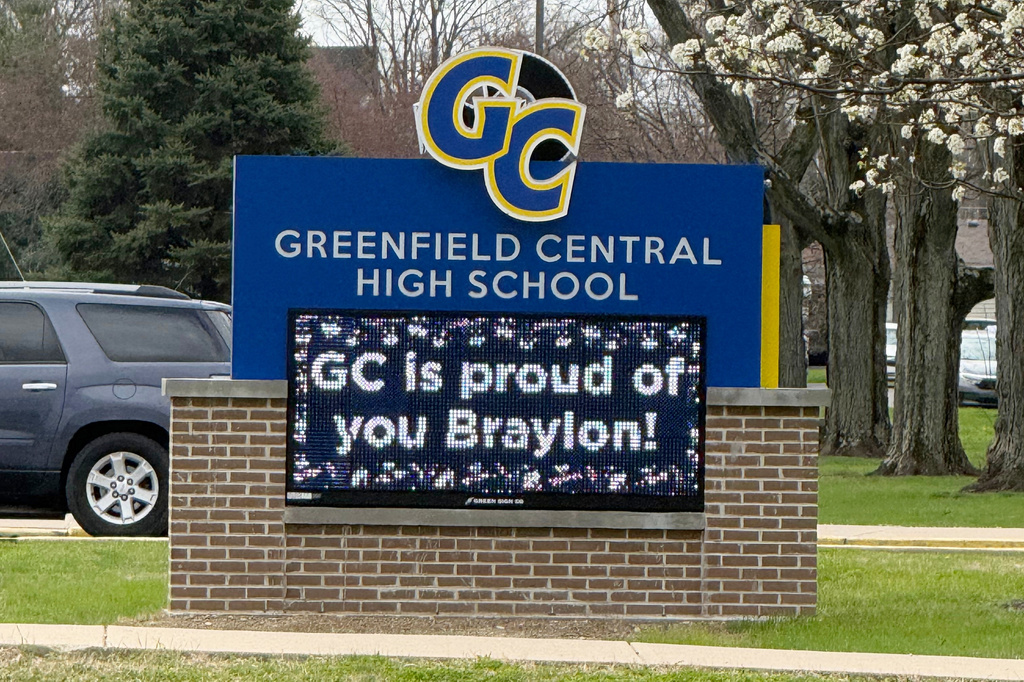 A digital sign outside Greenfield Central High School in Greenfield, Ind., congratulates the UConn men's college basketball team and Greenfield graduate Braylon Mullins, Monday, March 30, 2026, following the Husky's Elite Eight win over Duke in the NCAA Tournament. (AP Photo/Mike Marot)
