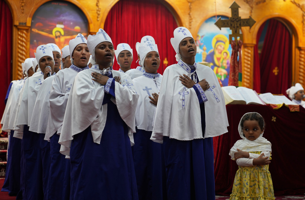 A Sunday school group performs a hymn during Good Friday service at Re'ese Adbarat Debre Selam Kidist Mariam Church, an Ethiopian Orthodox Tewahedo church, in Washington, Friday, April 10, 2026. (AP Photo/Jessie Wardarski)
