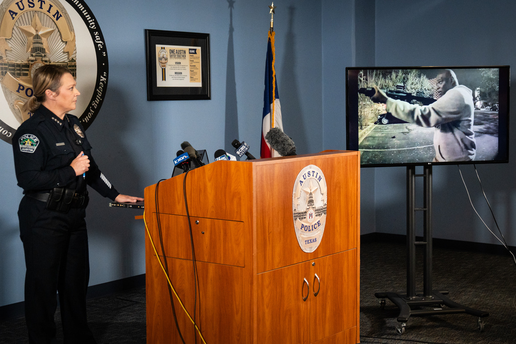 Austin Police Chief Lisa Davis watches footage from a parked vehicle near the scene that shows the suspected gunman during a news conference on Thursday, March 5, 2026 at APD headquarters regarding the release of audio and video footage from Sunday morning's mass shooting on West Sixth Street in Austin. (Sara Diggins/Austin American-Statesman via AP)