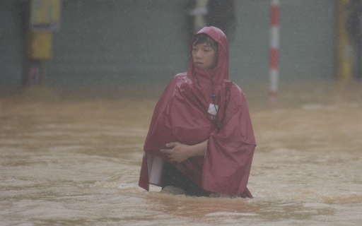 A man wades in a flooded street in Hue, Vietnam, Tuesday, Oct. 28, 2025. (Van Dung/VNA via AP) A man wades in a flooded street in Hue, Vietnam, Tuesday, Oct. 28, 2025. (Van Dung/VNA via AP)