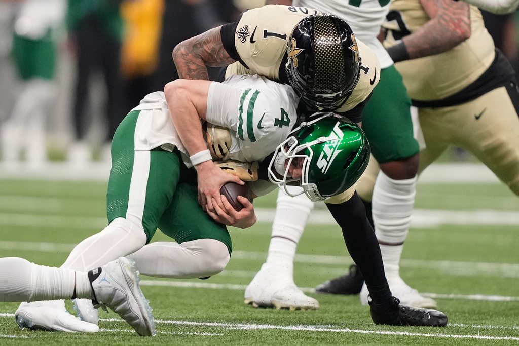 New Orleans Saints cornerback Alontae Taylor (1) sacks New York Jets quarterback Brady Cook during the second half of an NFL football game Sunday, Dec. 21, 2025, in New Orleans. (AP Photo/Gerald Herbert)