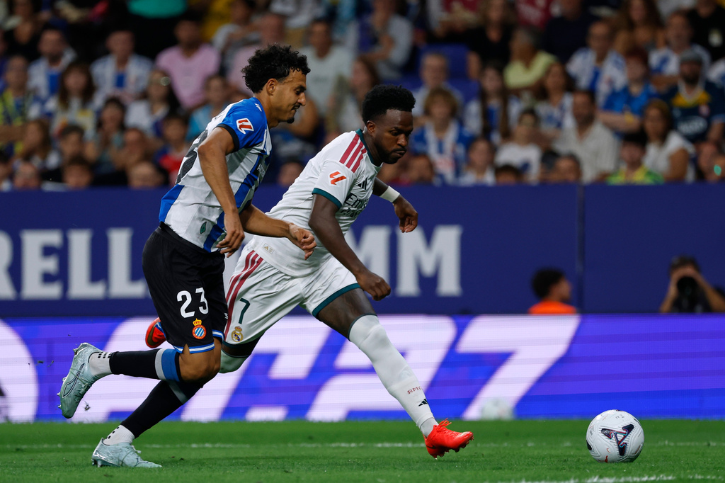 Real Madrid's Vinicius Junior, right, vies for the ball with Espanyol's Omar El Hilali during a Spanish La Liga soccer match between Espanyol and Real Madrid in Barcelona, Spain, Saturday, Aug. 22, 2026. (AP Photo/Joan Monfort)
