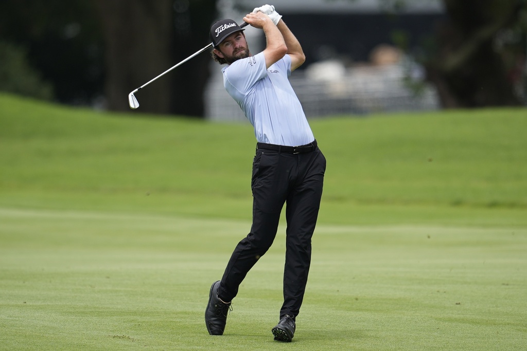 Cameron Young hits from the first fairway during the first round of the Tour Championship golf tournament, Thursday, Aug. 21, 2025, in Atlanta. (AP Photo/Mike Stewart)