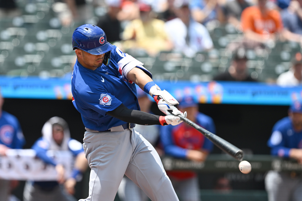 Chicago Cubs right fielder Seiya Suzuki (27) connects for a single against the Baltimore Orioles in the first inning of a baseball game, Thursday, July 9, 2026 in Baltimore. (AP Photo/Gail Burton)