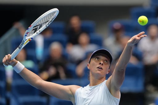 Iga Swiatek, of Poland tosses the ball to serve against Yuan Yue, of China during the women's singles match for the China Open tennis tournament, at the National Tennis Center, in Beijing, Saturday, Sept. 27, 2025. (AP Photo/Andy Wong) Iga Swiatek, of Poland tosses the ball to serve against Yuan Yue, of China during the women's singles match for the China Open tennis tournament, at the National Tennis Center, in Beijing, Saturday, Sept. 27, 2025. (AP Photo/Andy Wong)