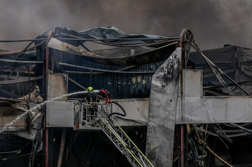 A firefighter works to extinguish a fire at a warehouse following a Russian attack, Saturday, Oct. 25, 2025, in Kyiv, Ukraine. (AP Photo/Julia Demaree Nikhinson) A firefighter works to extinguish a fire at a warehouse following a Russian attack, Saturday, Oct. 25, 2025, in Kyiv, Ukraine. (AP Photo/Julia Demaree Nikhinson)
