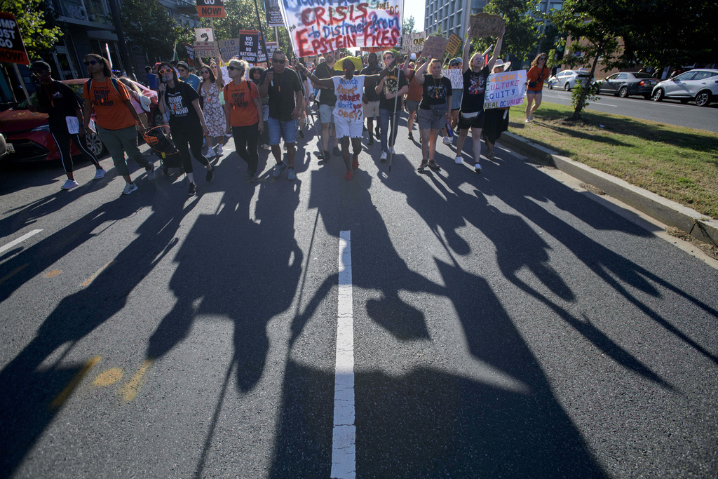 People march to protest against President Donald Trump's use of federal law enforcement and National Guard troops in Washington, Saturday, Aug. 23, 2025. (AP Photo/Rod Lamkey, Jr.)
