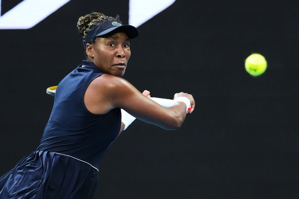 FILE - Venus Williams, of the United States, plays a backhand return to Olga Danilovic, of Serbia, during their first round match at the Australian Open tennis championship in Melbourne, Australia, Jan. 18, 2026. (AP Photo/Aaron Favila, File)