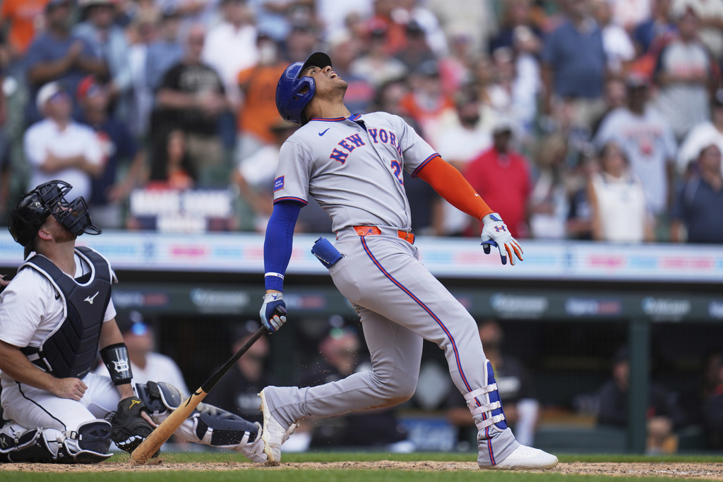 New York Mets' Juan Soto, right, reacts in front of Detroit Tigers catcher Jake Rogers after flying out to left fielder Riley Greene for the final out of a baseball game, Wednesday, Sept. 3, 2025, in Detroit. (AP Photo/Ryan Sun)
