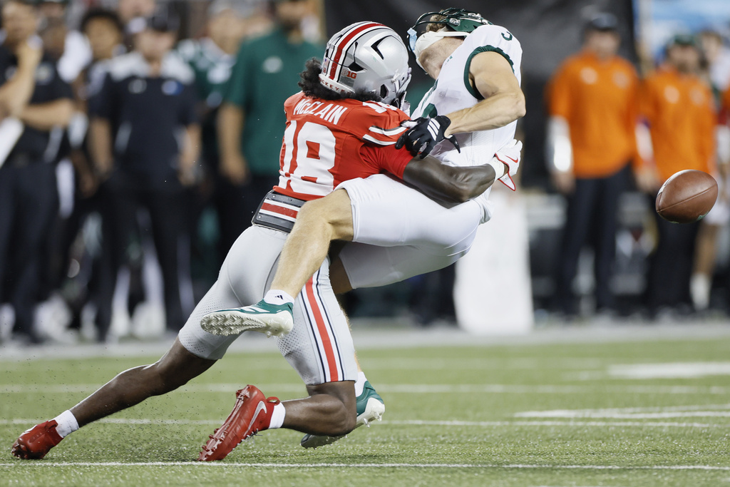 Ohio State defensive back Jaylen McClain, left, knocks the ball away from Ohio wide receiver Max Rodarte Pierre Kemen during the first half of an NCAA college football game, Saturday, Sept. 13, 2025, in Columbus, Ohio. (AP Photo/Jay LaPrete)