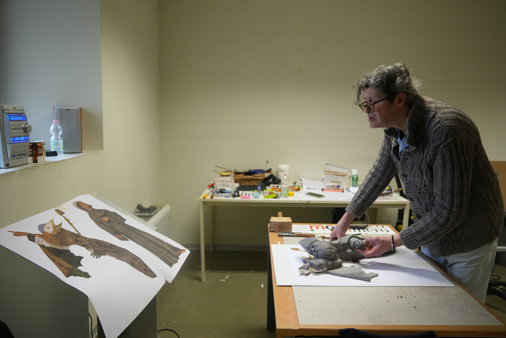 Massimiliano Trubbiani, an expert in tactile education for blind and visually impaired people, works to transform Titian's Pala Gozzi into bas-relief in a laboratory at the Omero Tactile Museum in Ancona, Italy, Friday, Jan. 16, 2026. (AP Photo/Alessandra Tarantino)